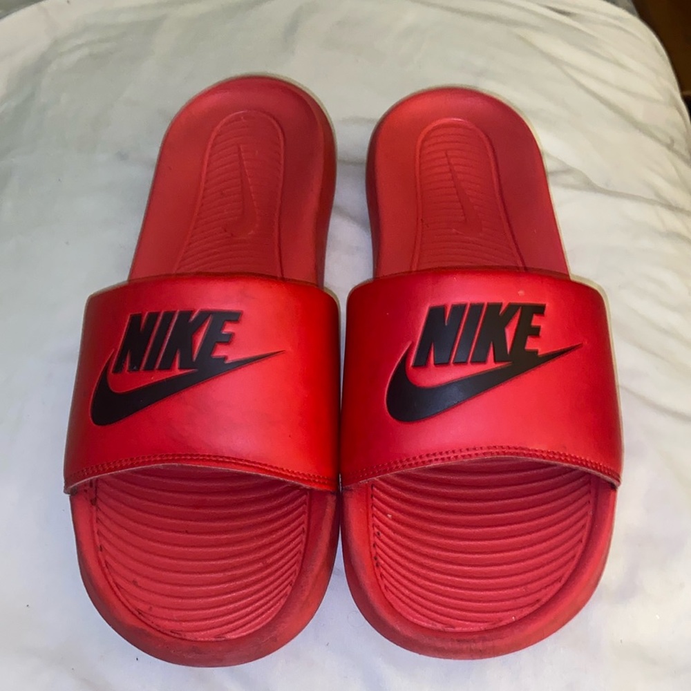 Red mens nike slides.